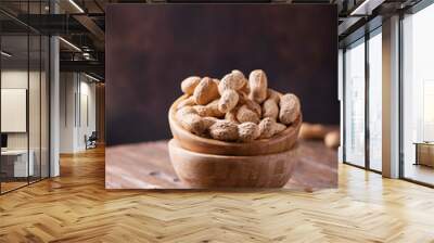  Roasted peanuts in wooden bowl Wall mural